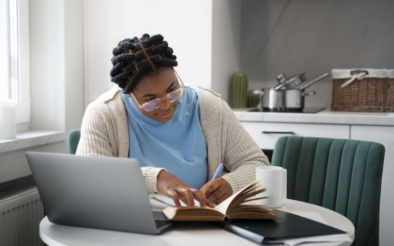 medium-shot-woman-with-laptop-home